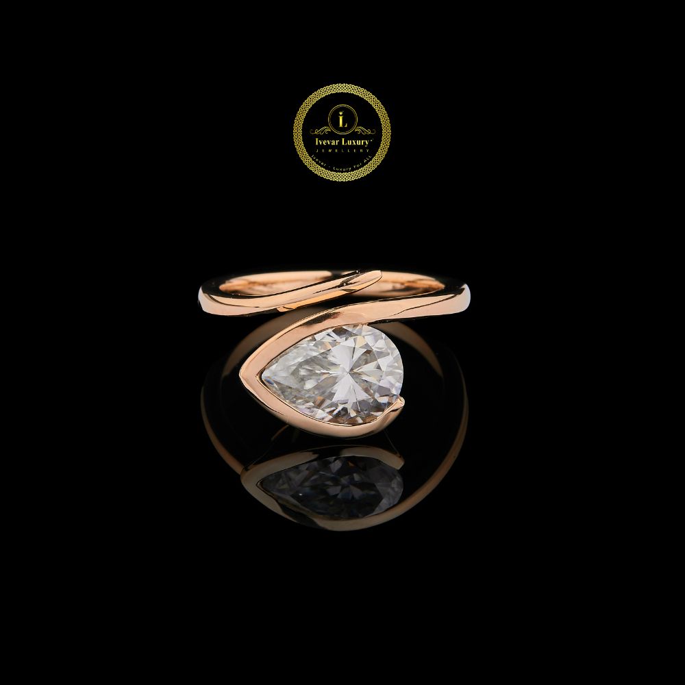 modern pear cut lab diamond bypass solitaire ring