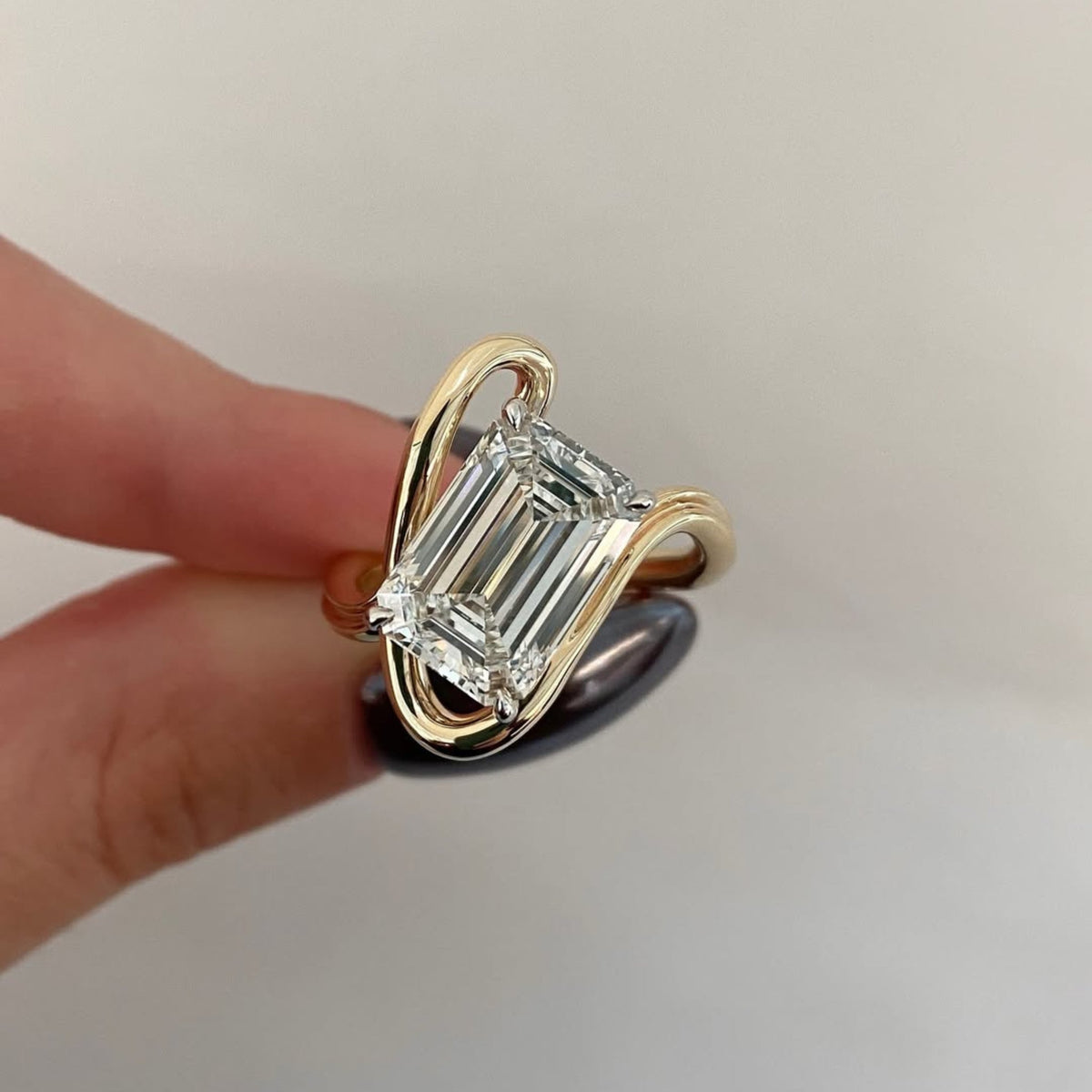 emerald cut moissanite diamond bypass ring