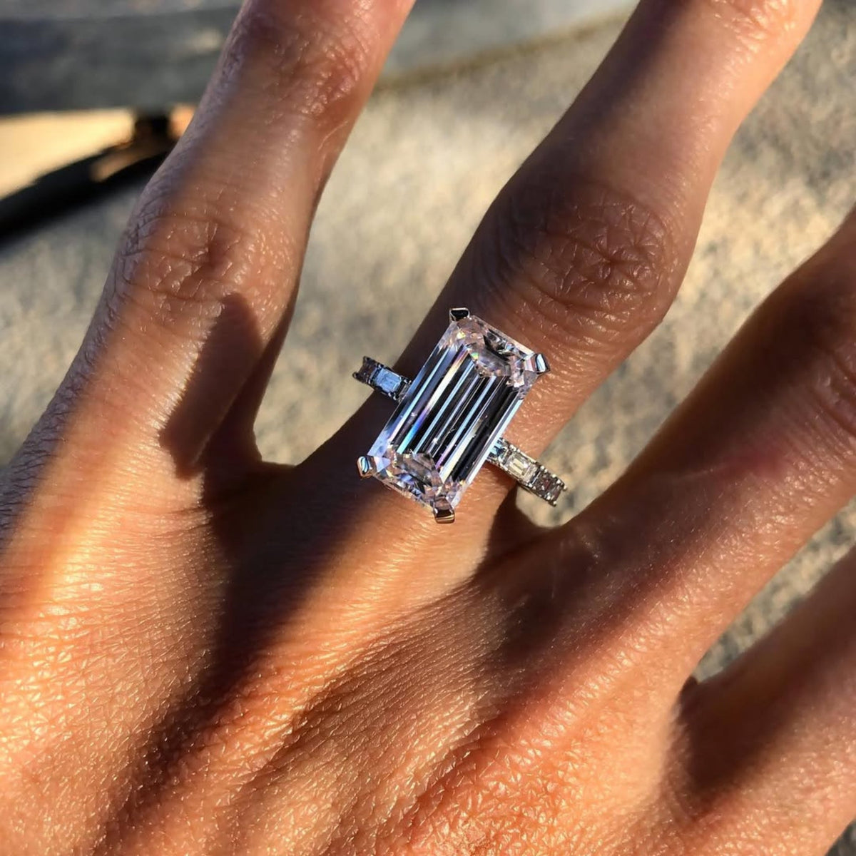 emerald cut moissanite diamond engagement ring with baguette sides